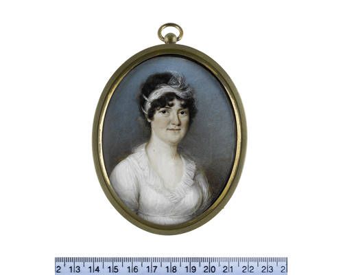 A Lady, wearing white dress with frilled lace collar, her dark upswept hair dressed with a white lace bandeau and strands of pearls