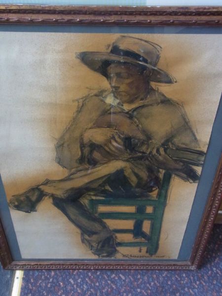 Guitarist Sur La Chaise Verte
