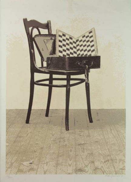 Chessboard in a suitcase on a chair