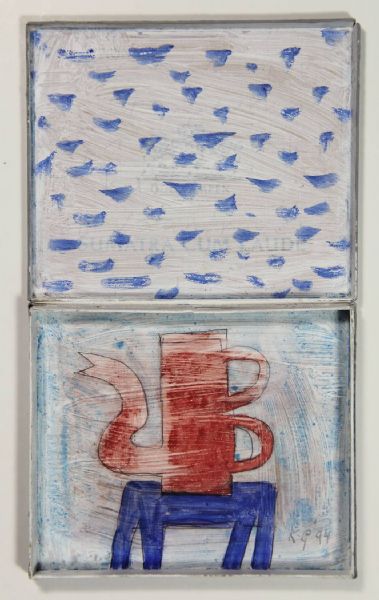 Red coffeepot on a blue table