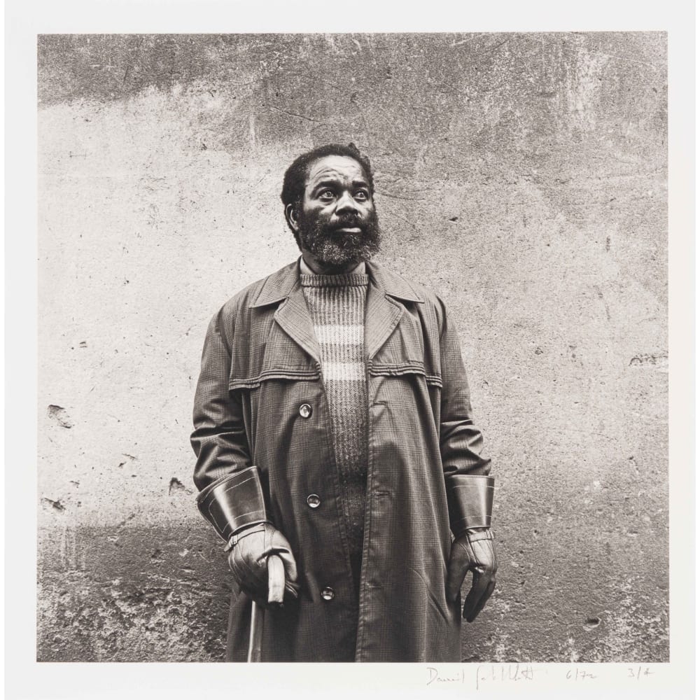 A flat cleaner going for a walk on his afternoon off, Hillbrow, Johannesburg. June 1972